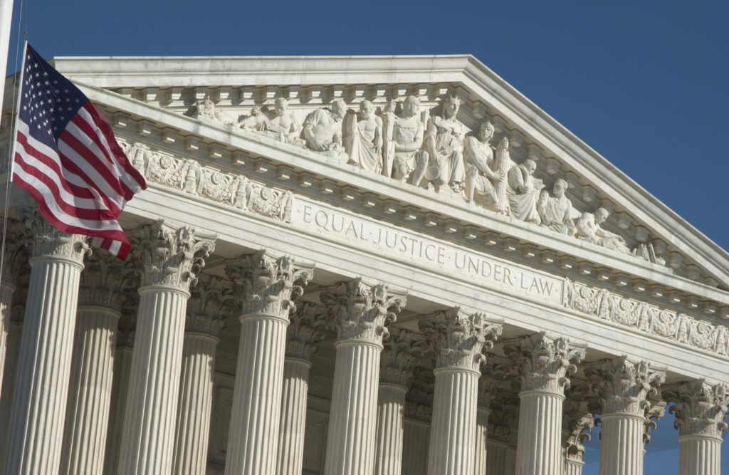 court news - picture of courthouse with American flag